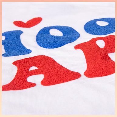 Letter patterns composed of red and blue puff vinyl.