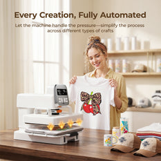 Woman holding a shirt with a design next to an auto multi heat press machine in a kitchen setting