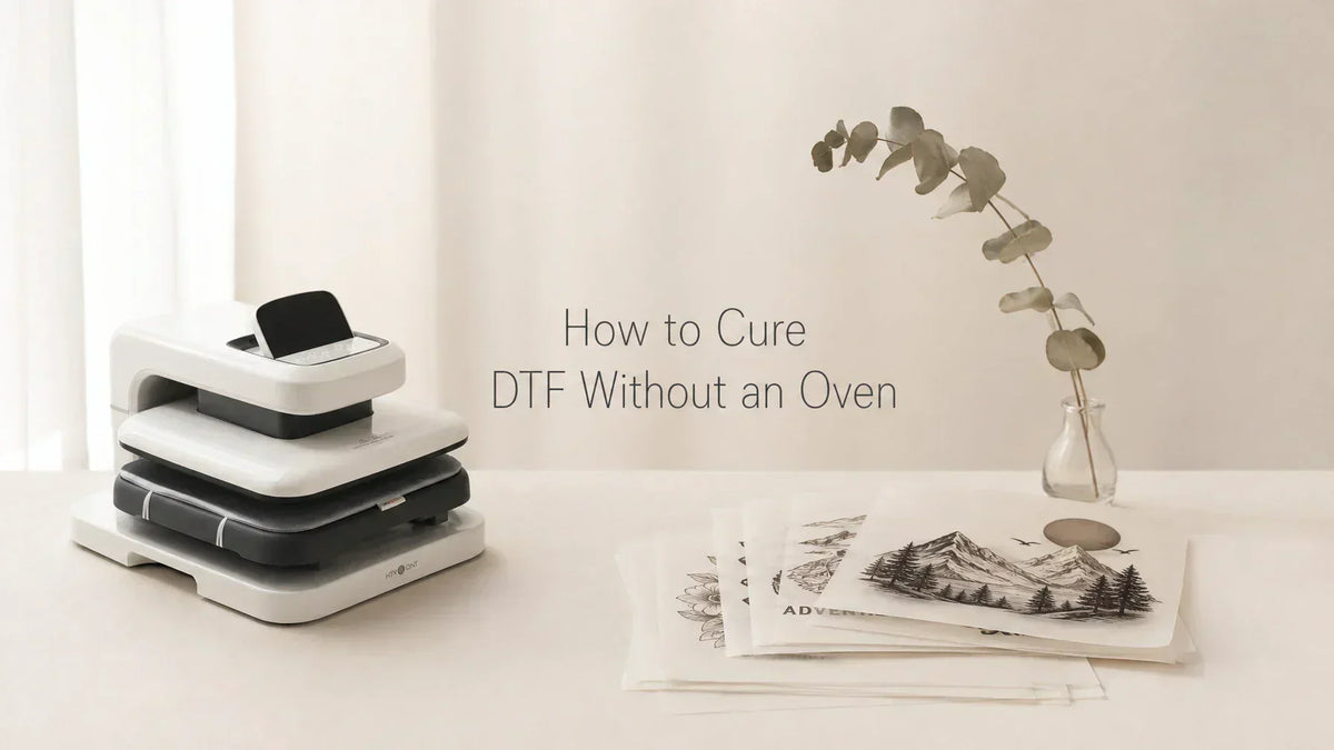 DTF transfer sheet curing on a heat press with parchment paper and craft tools on a wooden worktable