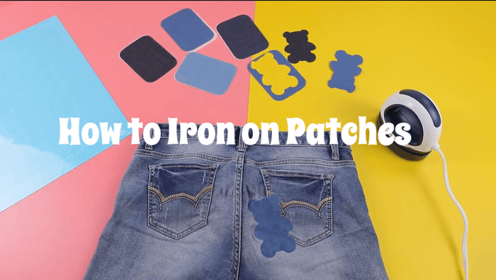 This covered image shows a variety of patches, a mini heat press and jeans.