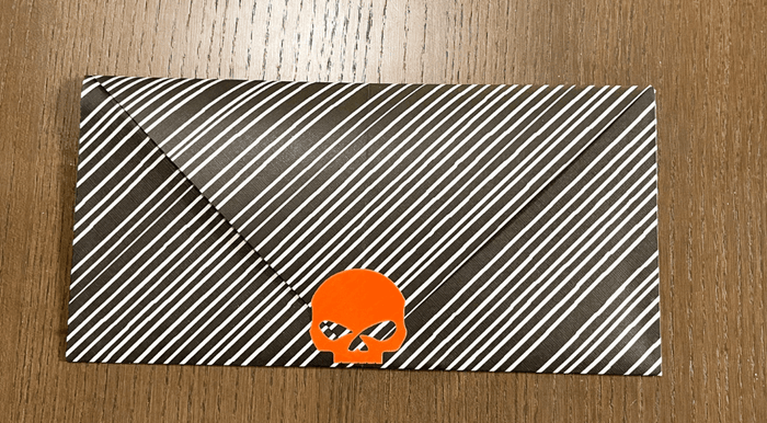 This image shows a featured envelope with black line pattern.