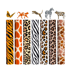 Set of animal print paper rolls with decorative cutouts on a white background