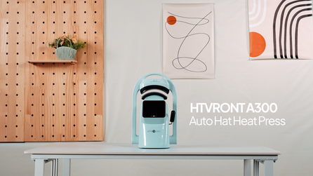 The light blue A300 Hat Heat Press is placed in the heat press workshop.