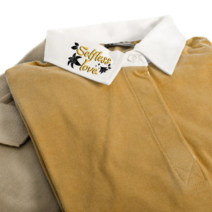 Brown corduroy pants with a white collar and 'Selfless Love' tag.