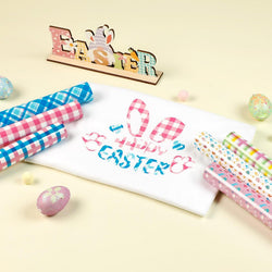Easter-themed paper with colorful text and checkered patterns on a light background