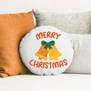 Round Christmas pillow with 'Merry Christmas' text and bells design on a couch.