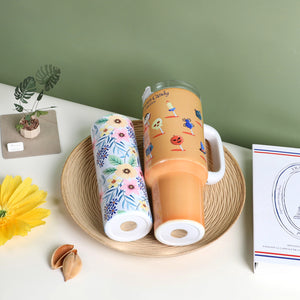 A straight tumbler and a handled tumbler lay on the desk