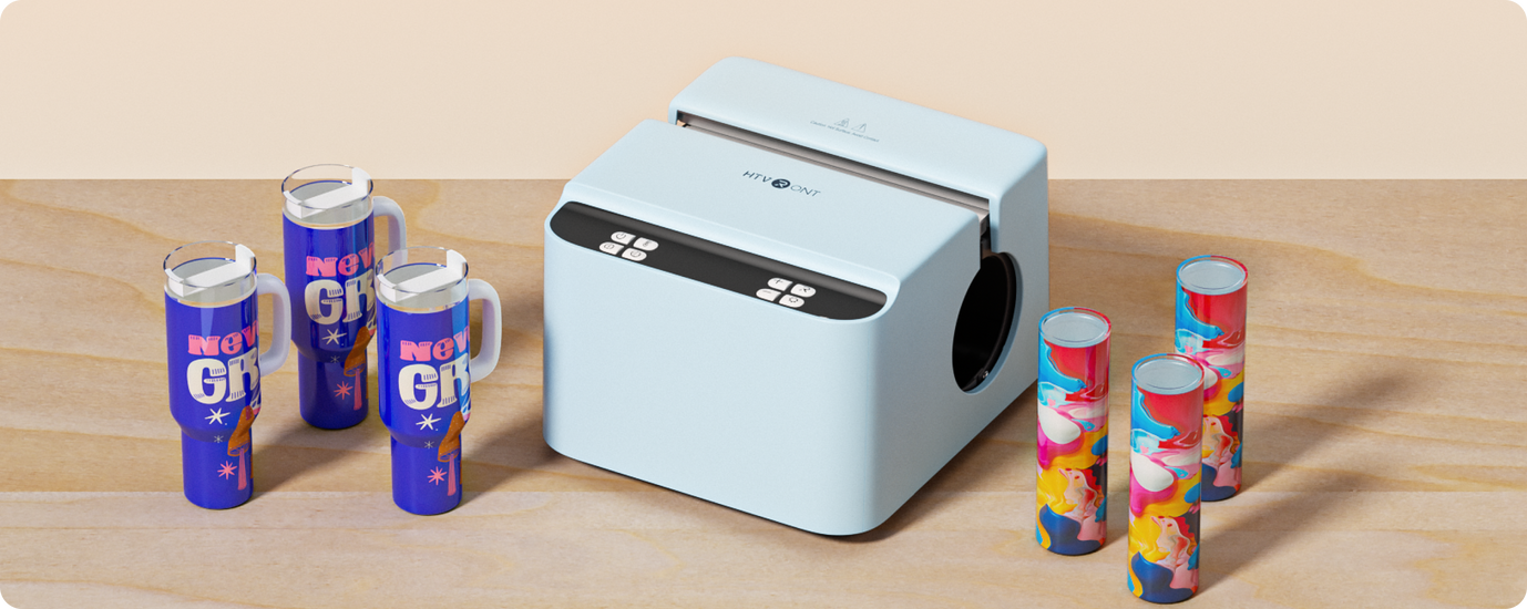 Cylindrical product packaging with colorful labels next to a white machine on a wooden surface.