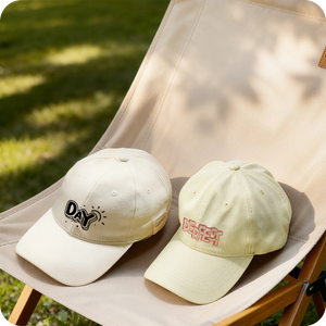 2 heat-pressed baseball caps under sunlight