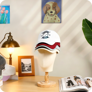 Three Hat-heat-pressed baseball caps stacked together