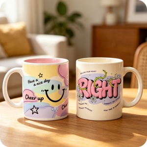 Two mugs with colorful designs and text on a wooden surface.